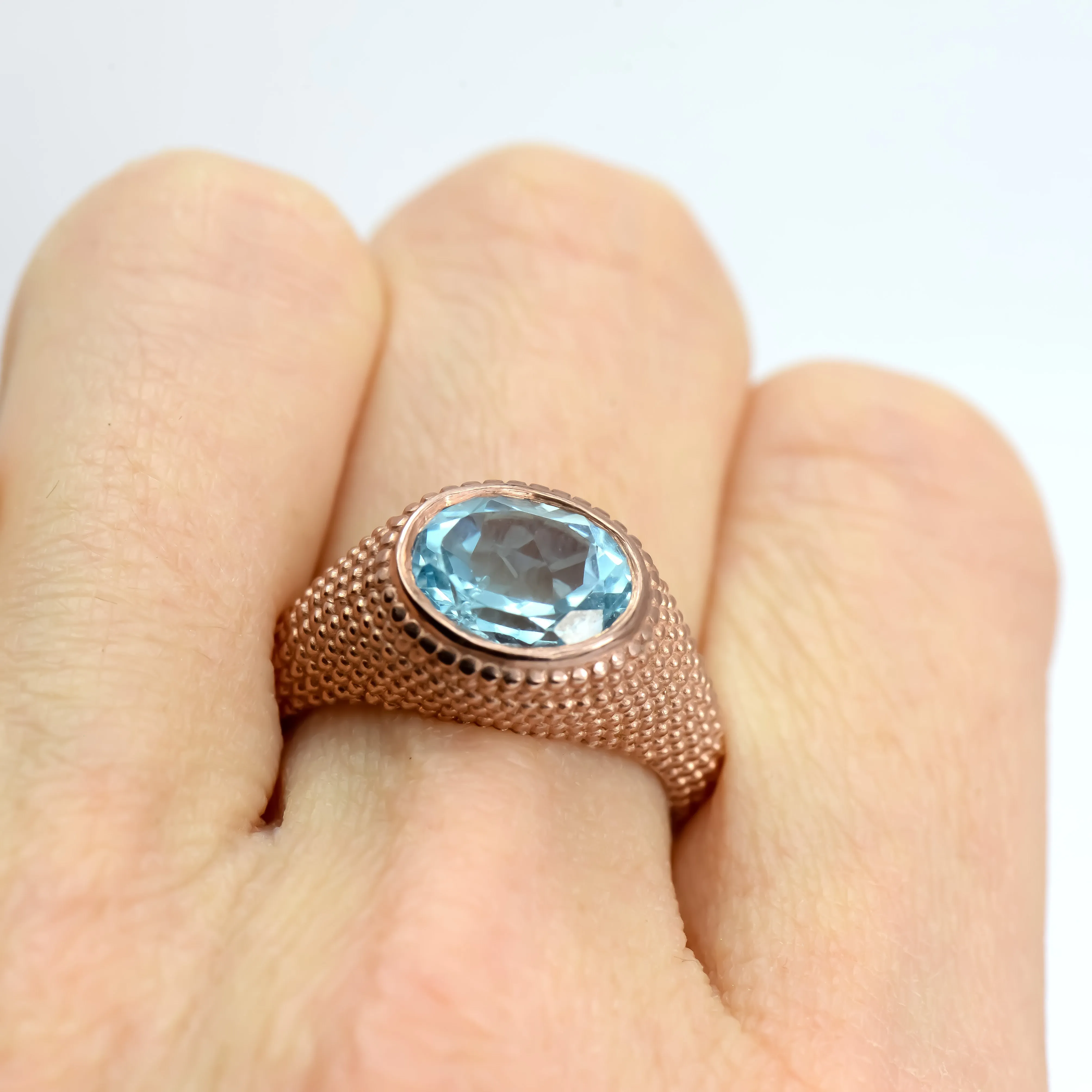 Nubia Oval Blue Topaz Rose Gold Ring Size 7US